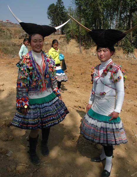 Jpeg 64K White Miao girls in festival dress at the White Miao Dance Flower festival near Dafang in April 2007