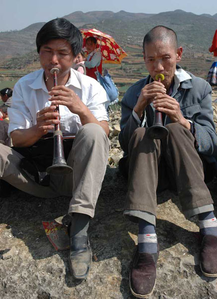Jpeg 66K White Miao men playing suona at the Dance Flower festival near Dafang in April 2007
