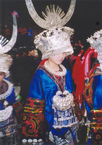 Jpeg 56K E14e Tony Chen's girlfriend resplendent in her festival costume dancing on 29 February 2004, Langde village, Guizhou province