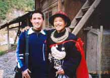 to Jpeg 53K E16e Tony Chen with the Shaman on 25 February 2004, the fourth day of the festival, when the spirit of the Mountain Dragon was taken into each house in the village by the Shaman and the leading men of Langde village, Guizhou province