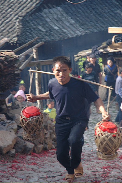 69K Jpg image The rice wine given by Tony's older sister being carried up to the village