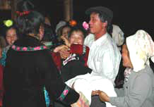 to 54K Jpg image The villagers from the groom's village wrestling for fun.