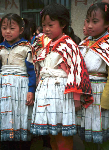 Young Big Flower Miao girls dressed in their festival finery - Xian Ma village, Hou Chang township, Puding county, Guizhou province 0010x23.jpg