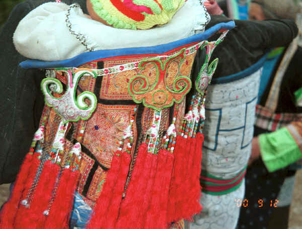 Close up of Side Comb Miao Baby carrier ornamentation - Xian Ma village, Hou Chang township, Puding county, Guizhou province 0010y20.jpg