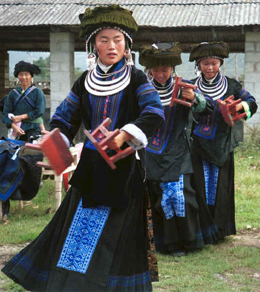 Young Black Miao girls dressed in their festival finery dancing. Zuo Qi village, Min Gu township, Zhenfeng county, Guizhou province 0010p25.jpg