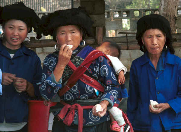 Black Miao women eating festival sticky rice, Zuo Qi village, Min Gu township, Zhenfeng county, Guizhou province 0010q10.jpg