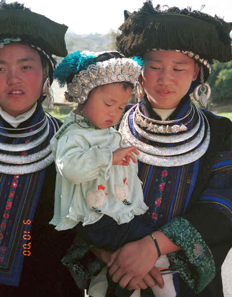 Black Miao young women with baby all in their festival finery, Zuo Qi village, Min Gu township, Zhenfeng county, Guizhou province 0010q22.jpg