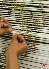 to 89K Jpg - tying ikat with palm frond in Sikka village