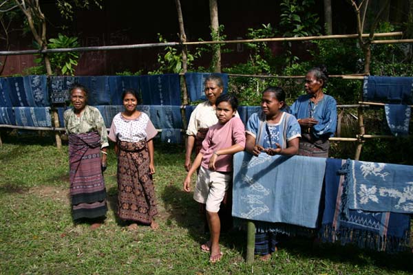 53K Jpeg 0193 Some of the weavers of Watublapi, Flores, who use homegrown cotton and natural dyes for their weaving, in front of some of their textiles (2004).