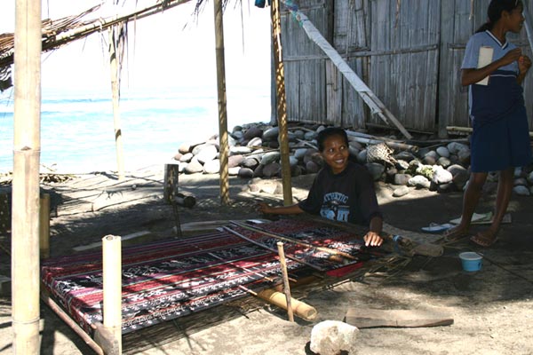 56K Jpeg 0215 Weavers can be found along the roadsides in all the villages in Flores. This is around Bola village on the south coast of the island (2004).