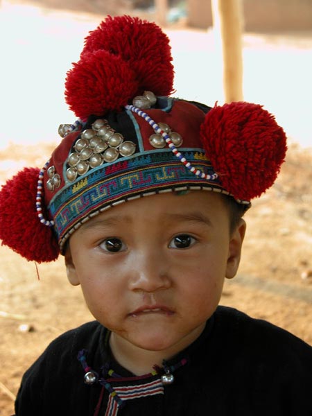 Jpeg 40K Young Yao boy wearing a traditional style protective hat in a village near Chiang Rai  3240