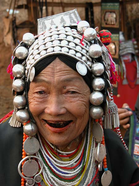 Jpeg 54K Old Loimi-Akha woman in a village near Chiang Rai with her teeth stained by chewing betel nut. 3248