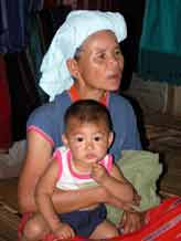 to Jpeg 58K A Karen woman and young boy in a village on Doi Inthanon 3383