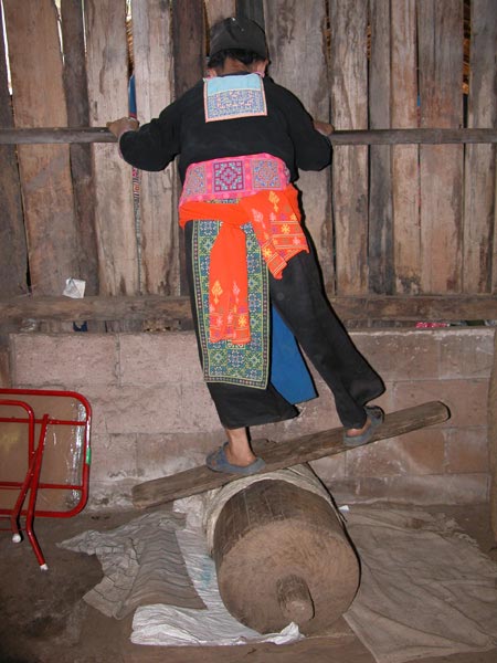 Jpeg 55K White Hmong woman softening hemp thread in the village of Ban Pha-nok-kok  3433