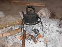 to Jpeg 54K Kettle on the hearth in a White Hmong house in the village of Ban Pha-nok-kok  3438