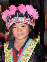 to Jpeg 57K Young White Hmong girl in Ban Pha-nok-kok village dressed in her festival finery  3444