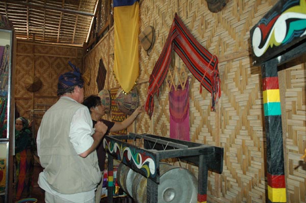 56K Jpg - Nick Fielding looking at some old weavings at the Aljamelah Inaul Weaving and Sewing Center - Mindanao, 2007