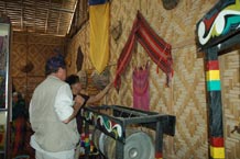 to 56K Jpg - Nick Fielding looking at some old weavings at the Aljamelah Inaul Weaving and Sewing Center - Mindanao, 2007