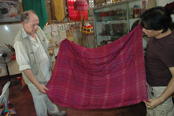 Jpg 60K Nick Fielding examining an old silk textile at the Aljamelah Inaul Weaving and Sewing Center - Mindanao, 2007 