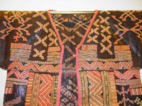 to 75K Jpg 20 - Detail 2 Bla'an man's abaka, cotton and embroidered jacket and trousers, Mindanao, 19th century. Jacket 145 cm x 58 cm x 41 cm, Trousers 43 cm x 53 cm