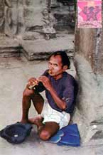 to ss21 Jpeg 55K Another photo I took in Ankor Wat in 1996.  He does not appear so friendly on second viewing!