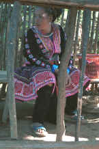 to Jpeg 36K Blue Hmong woman dressed in all her finery in a village on Doi Suthep above Chiang Mai 8812l05