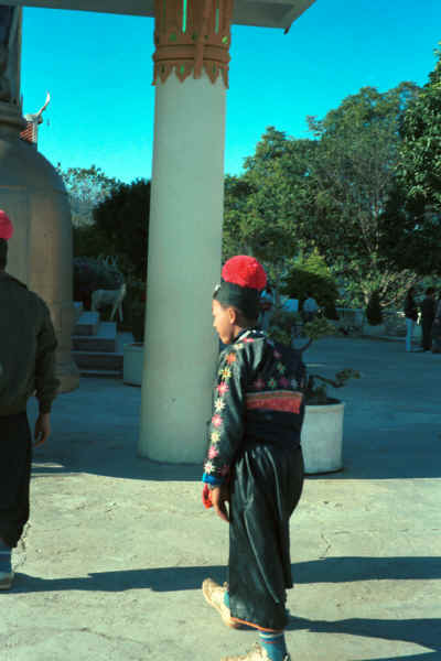 Blue Hmong boy walking through Wat Doe Suthep 8812l24