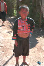 to Jpeg 34K Blue Hmong boy in a village on Doi Chiang Dao along the road from Chiang Mail to Fang 8812n32