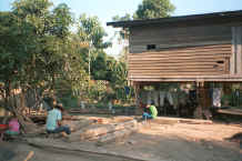 to Jpeg 42K Working on building timber at a Sgaw Karen village along the Mae Kok river between Tha Thon and Chiang Rai in northern Thailand 8812o31.jpg