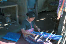 to Jpeg 28K Sgaw Karen woman weaving at her backstrap loom dressed in a traditional hand-woven blouse 8812o36B.jpg