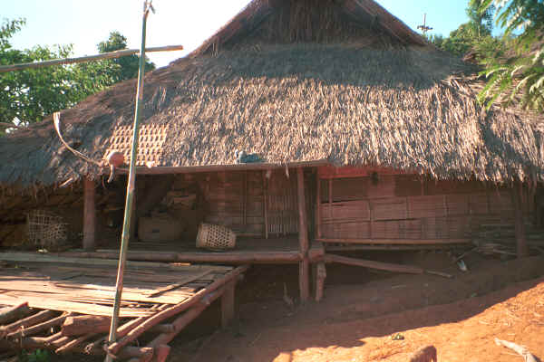 U Lo-Akha house showing basket on the verandah in a village in the hills around Chiang Rai 8812p18.jpg