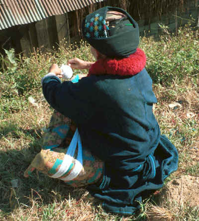 A Yao woman winding her embroidery thread in a village in the hills around Chiang Rai 8812q12.jpg