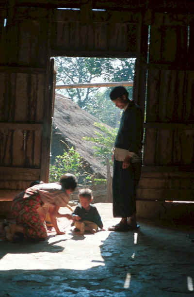 A young Yao family framed in the doorway of their house in a village in the hills around Chiang Rai 8812q14.jpg