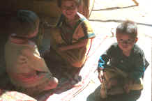 to Jpeg 22K Yao children playing inside a house door-way in a village in the hills around Chiang Rai 8812q15.jpg