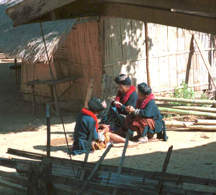 Yao women sitting in the sun working on their embroidery in a village in the hills around Chiang Rai 8812q27.jpg