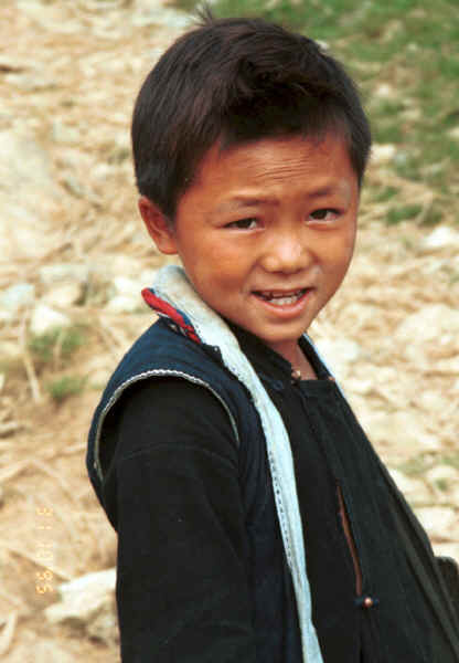 Jpeg 24K Black Hmong boy walking home from school in the hills around Sa Pa, Lao Cai Province 9510K11.JPG