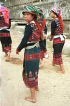 to 47K Jpeg 9510I14 Four very shy Phula, Xa Pho girls in Sa Pa, Lao Cai Province, north west Vietnam. Note the wool embroidery on the blouse and skirts with Jacob's tear seeds on the blouses.