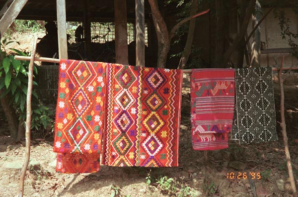 Southern White Thai weavings hanging outside houses in In Ban Lac village in the Mai Chau district, Hoa Binh (Ha Son Binh) Province, Vietnam 9510A19E