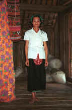 to Jpeg 29K Woman modeling a head scarf in a Southern Thai house in Ban Lac village, Mai Chau District in Hoa Binh Province near the border with the north-western part of Thanh Hoa Province in north west Vietnam 9510A24.JPG